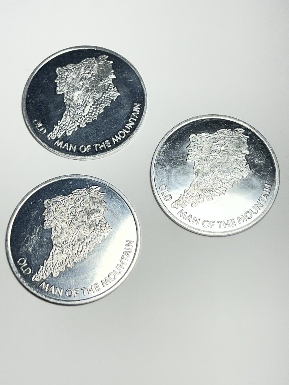 Vintage Old Man On The Mountain Aluminum Lottery Tokens Lot Of Three.